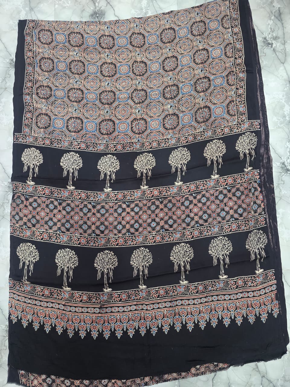 Ajrakh saree with ornate patterns and rich colors